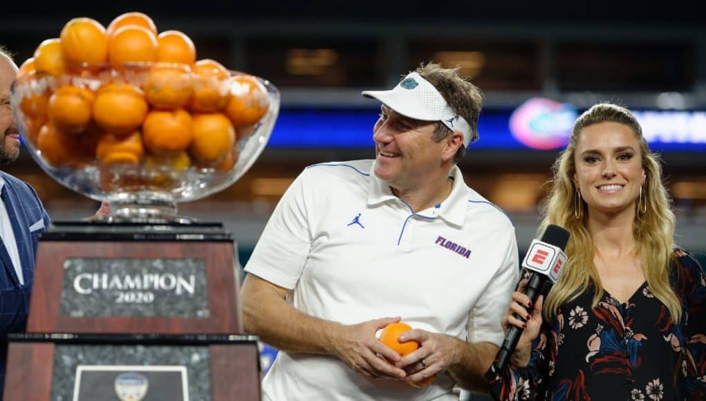 University of Florida head coach Dan Mullen accepts the orange Bowl trophy after the Gators’ win over Virginia- Florida Gators football- 1280x852