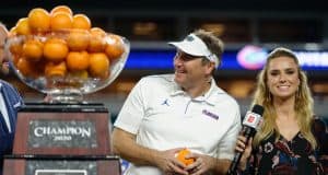 University of Florida head coach Dan Mullen accepts the orange Bowl trophy after the Gators’ win over Virginia- Florida Gators football- 1280x852