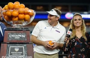 University of Florida head coach Dan Mullen accepts the orange Bowl trophy after the Gators’ win over Virginia- Florida Gators football- 1280x852