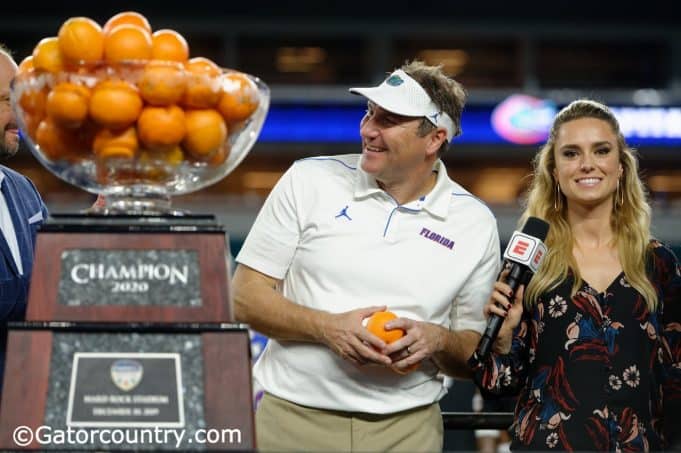 University of Florida head coach Dan Mullen accepts the orange Bowl trophy after the Gators’ win over Virginia- Florida Gators football- 1280x852