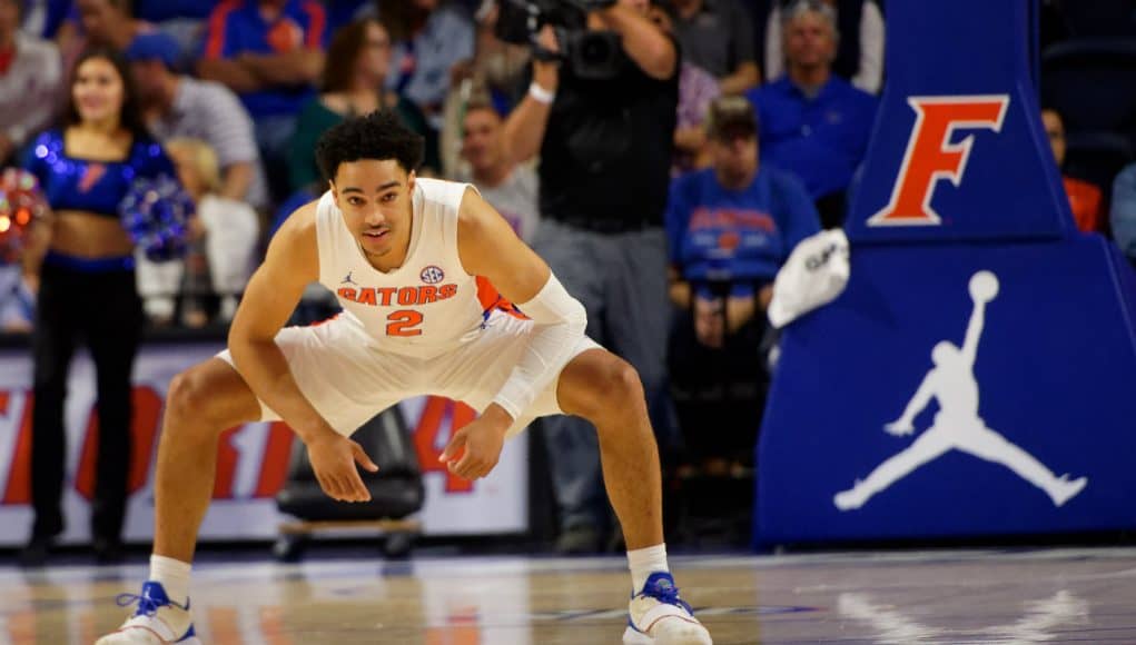 University of Florida guard Andrew Nembhard stretches before tipoff against Florida State- Florida Gators basketball- 1280x853