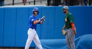 University of Florida second baseman Cory Acton looks towards the dugout after a single against Miami- Florida Gators baseball- 1280x853