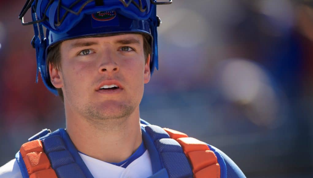 University of Florida catcher Nathan Hickey walks off the field after the Florida Gators 7-3 win over Troy- Florida Gators baseball- 1280x853