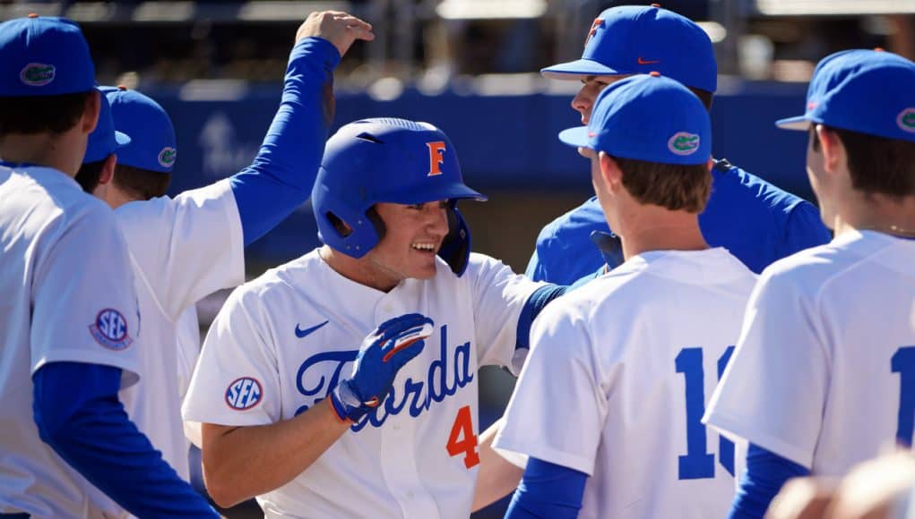 University of Florida outfielder Jud Fabian is greeted after a three-run home run against Troy- Florida Gators baseball-1280x853