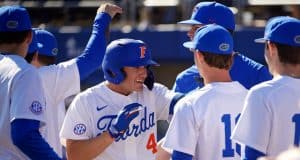 University of Florida outfielder Jud Fabian is greeted after a three-run home run against Troy- Florida Gators baseball-1280x853
