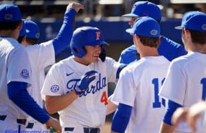University of Florida outfielder Jud Fabian is greeted after a three-run home run against Troy- Florida Gators baseball-1280x853