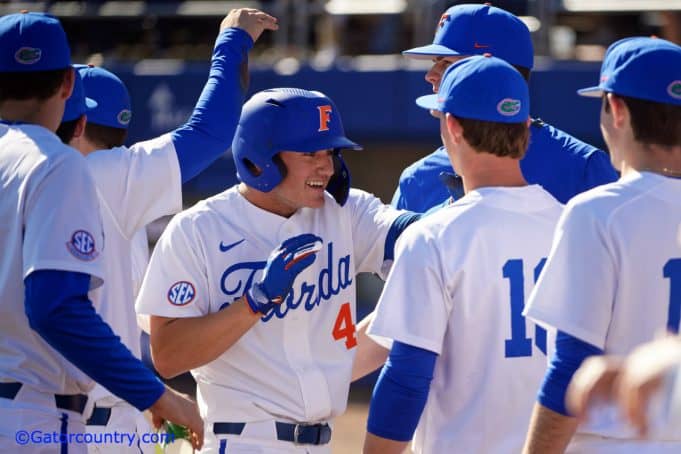 University of Florida outfielder Jud Fabian is greeted after a three-run home run against Troy- Florida Gators baseball-1280x853