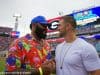 University of Florida alumni Brandon Spikes and Tim Tebow greet each other on the field before the Florida Gators game against Georgia- Florida Gators football - 1250x853