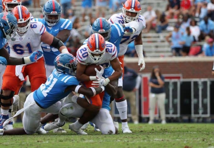Malik Davis breaks a tackle against Ole Miss- 1186x820