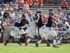 Defensive end Brenton Cox rushes Kellen Mond. - 1149x800