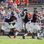 Defensive end Brenton Cox rushes Kellen Mond. - 1149x800