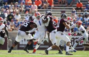 Defensive end Brenton Cox rushes Kellen Mond. - 1149x800