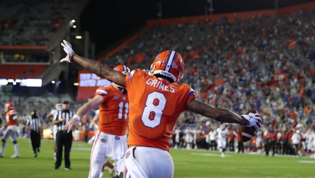 Receiver Trevon Grimes celebrates with Kyle Trask-1158x800