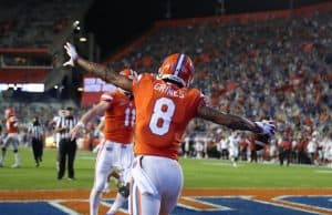 Receiver Trevon Grimes celebrates with Kyle Trask-1158x800