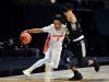 Guard Tre Mann drives against Army-1200x800