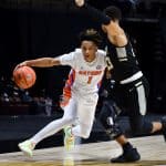 Guard Tre Mann drives against Army-1200x800