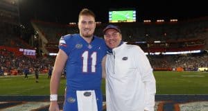 Quarterback Kyle Trask with head coach Dan Mullen during senior night-1200x897