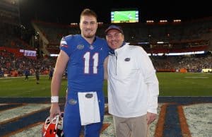 Quarterback Kyle Trask with head coach Dan Mullen during senior night-1200x897