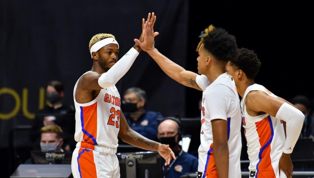 Scottie Lewis celebrates with Tre Mann against Army-1200x800