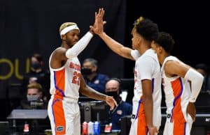 Scottie Lewis celebrates with Tre Mann against Army-1200x800