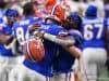Quarterbacks Emory Jones and Kyle Trask hug during the Cotton Bowl - 1280x853