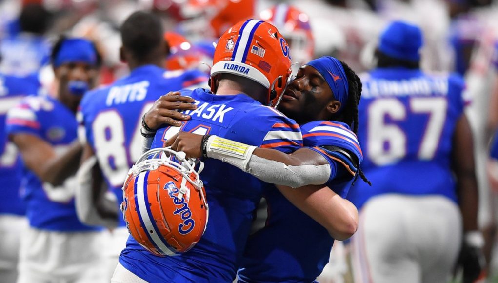 Quarterbacks Emory Jones and Kyle Trask hug during the Cotton Bowl - 1280x853