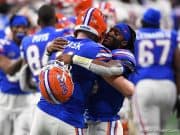 Quarterbacks Emory Jones and Kyle Trask hug during the Cotton Bowl - 1280x853