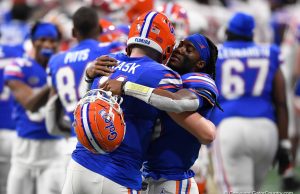 Quarterbacks Emory Jones and Kyle Trask hug during the Cotton Bowl - 1280x853