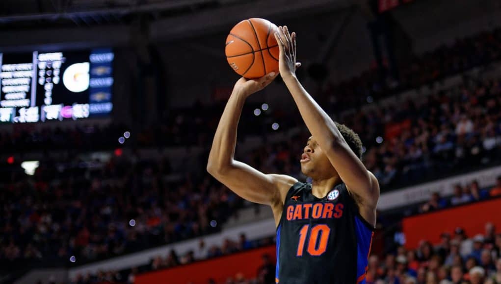 Noah Locke shoots a three-pointer against Auburn in 2020 - 1280x853