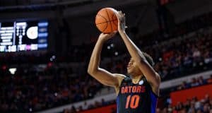 Noah Locke shoots a three-pointer against Auburn in 2020 - 1280x853