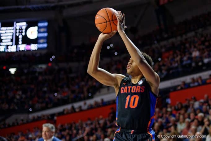Noah Locke shoots a three-pointer against Auburn in 2020 - 1280x853