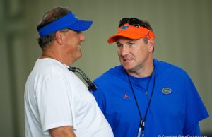 Dan Mullen and Todd Grantham have a discussion ahead of spring practice - 1280x854