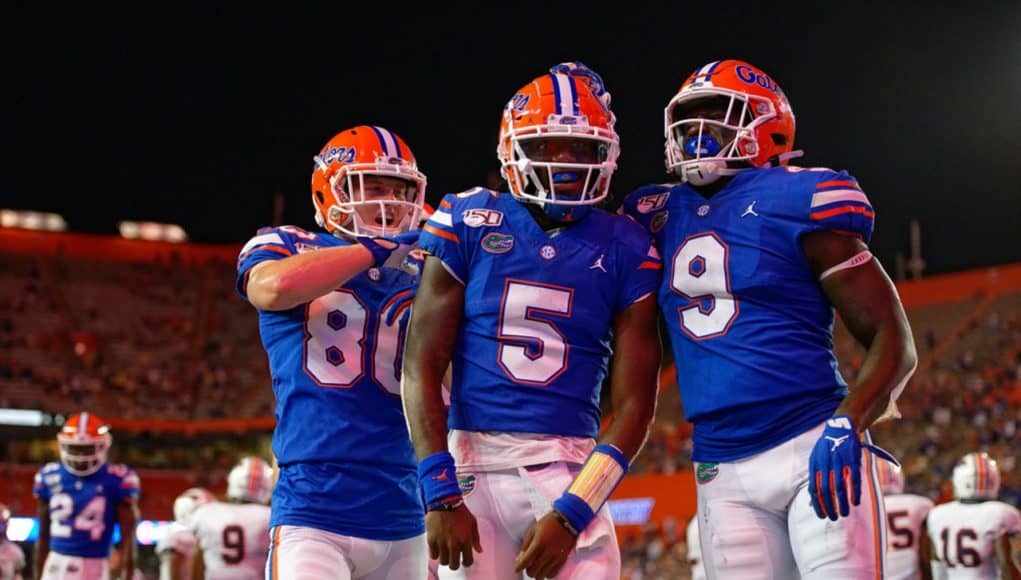 Trent Whittemore, Emory Jones and Keon Zipperer celebrate a touchdown against Auburn in 2019 - 1280x854