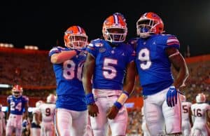 Trent Whittemore, Emory Jones and Keon Zipperer celebrate a touchdown against Auburn in 2019 - 1280x854