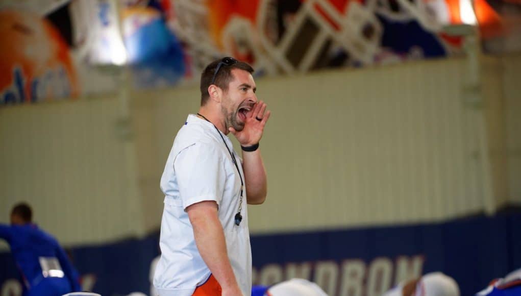 Florida Gators strength coach Nick Savage during team warmups at a 2019 spring practice - 1280x853