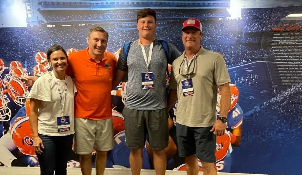 Offensive lineman Preston Cushman with Florida Gators head coach Dan Mullen-1000x776