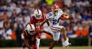 Running back Malik Davis runs against FAU in the season opener- 1280x853