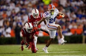 Running back Malik Davis runs against FAU in the season opener- 1280x853