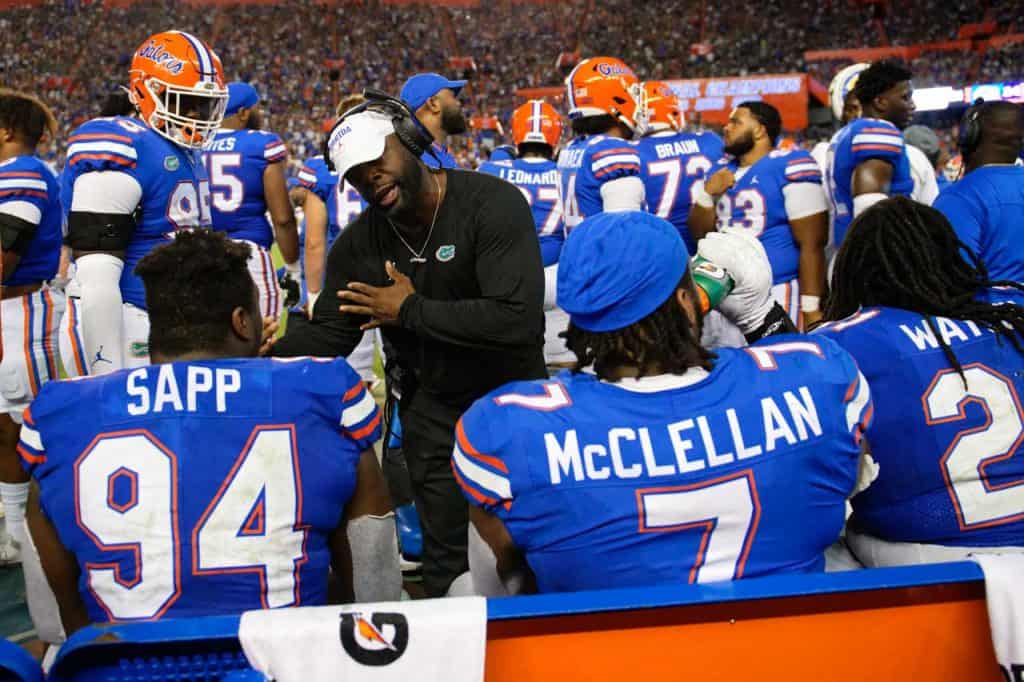 Defensive line coach Sean Spencer talks with his defensive line during the USF game- 1280x853