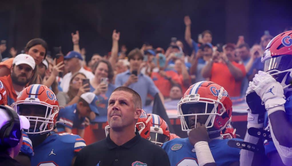 Florida Gators head coach Billy Napier and the team enter the Swamp before Kentucky- 1280x886