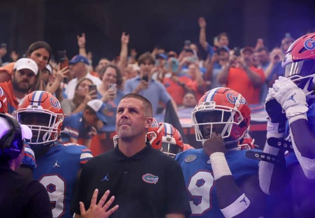 Florida Gators head coach Billy Napier and the team enter the Swamp before Kentucky- 1280x886