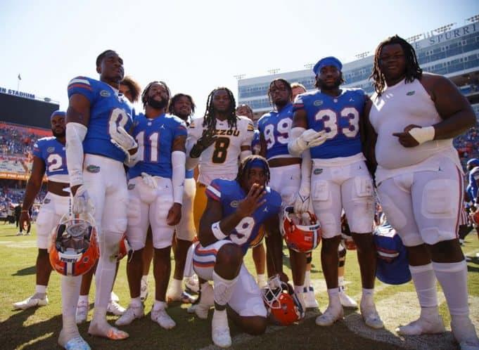 Florida Gators players celebrate with their old teammate, Mizzou Tigers linebacker Ty'Ron Hopper #8, after the Gators win over the Tigers on October 6th, 2022. (Gator Country/Sammy Harrison)- 1280x936