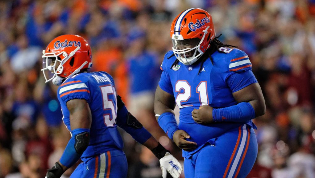 Florida Gators defensive lineman Desmond Watson recovers a fumble against South Carolina- 1280x853