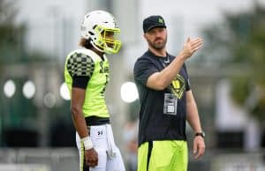 Florida Gators Football signee quarterback Jaden Rashada talks with his Team Speed coach-1280x853
