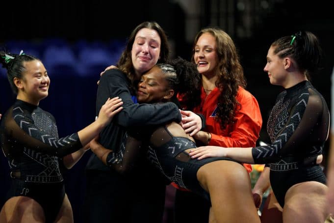 The #3 Florida Gators gymnastics team celebrates winning their 5th straight SEC title- 1280x853
