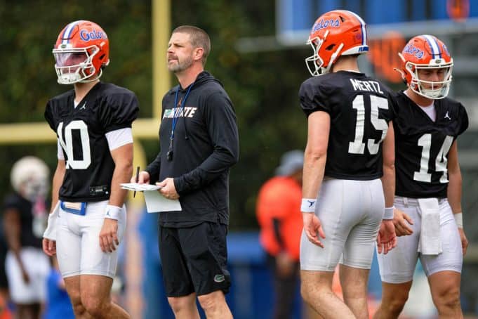 Florida Gators head coach Billy Napier with the quarterbacks during spring practice- 1280x853