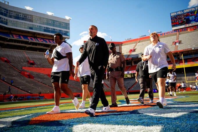 Florida Gators football head coach Billy Napier and the Gators walk into Ben Hill Griffin Stadium as they get ready for the 2023 Orange and Blue Game- 1280x853