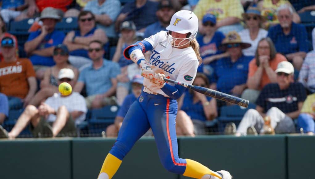 Florida Gators right fielder Taylor Shumaker hits against Texas- 1280x853