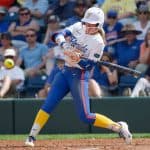 Florida Gators right fielder Taylor Shumaker hits against Texas- 1280x853