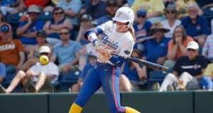 Florida Gators right fielder Taylor Shumaker hits against Texas- 1280x853